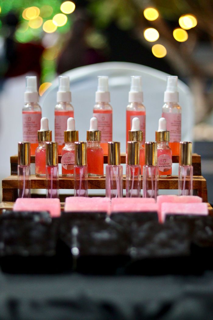 journey Chic arrangement of pink perfumes and soaps on display, perfect for beauty promotions.
